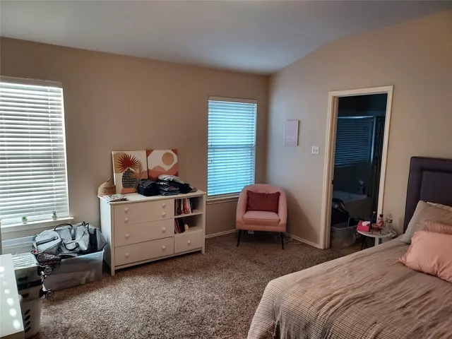 a room with a bed and a window