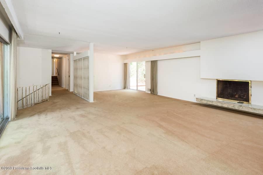 2107 Pinecrest Drive Altadena, CA 91001 - Photo 11 of 37 a view of empty room with fireplace and window