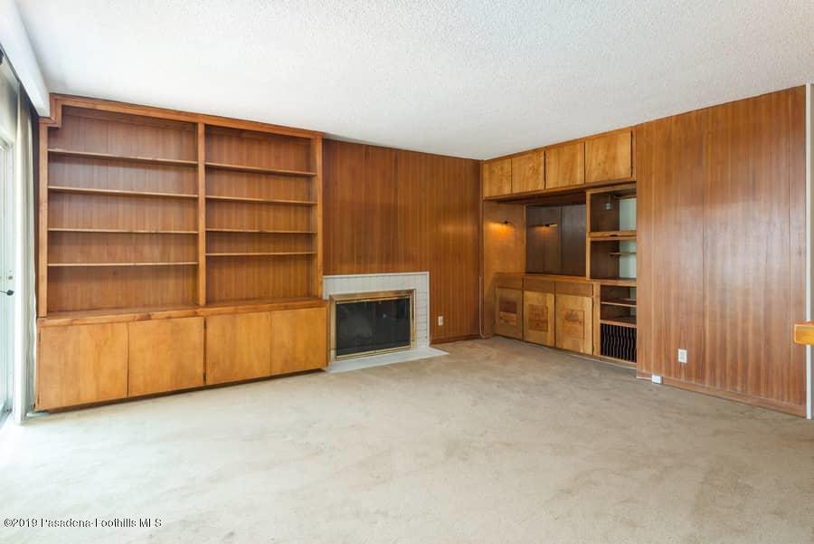 2107 Pinecrest Drive Altadena, CA 91001 - Photo 16 of 37 a view of an empty room with a cabinet and mirrors
