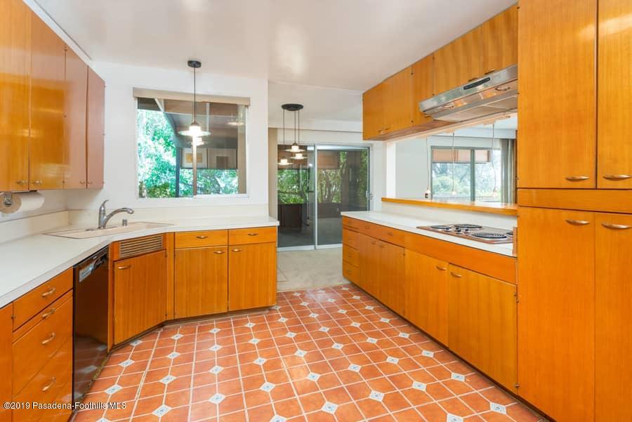 2107 Pinecrest Drive Altadena, CA 91001 - Photo 18 of 37 a large kitchen with stainless steel appliances granite countertop a sink and cabinets
