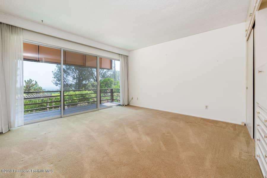 2107 Pinecrest Drive Altadena, CA 91001 - Photo 20 of 37 a view of an empty room with wooden floor and a window