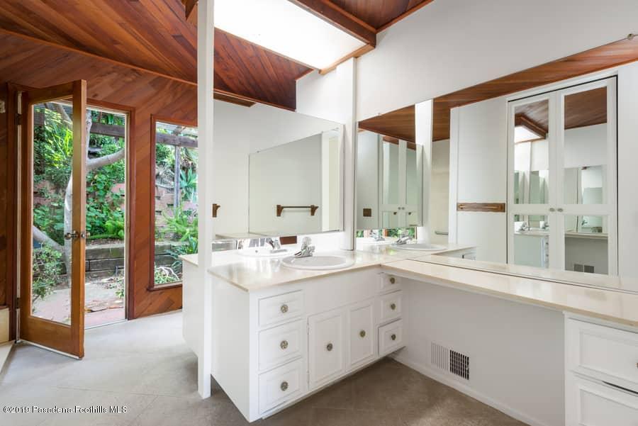 2107 Pinecrest Drive Altadena, CA 91001 - Photo 23 of 37 a kitchen with a sink stove and cabinets