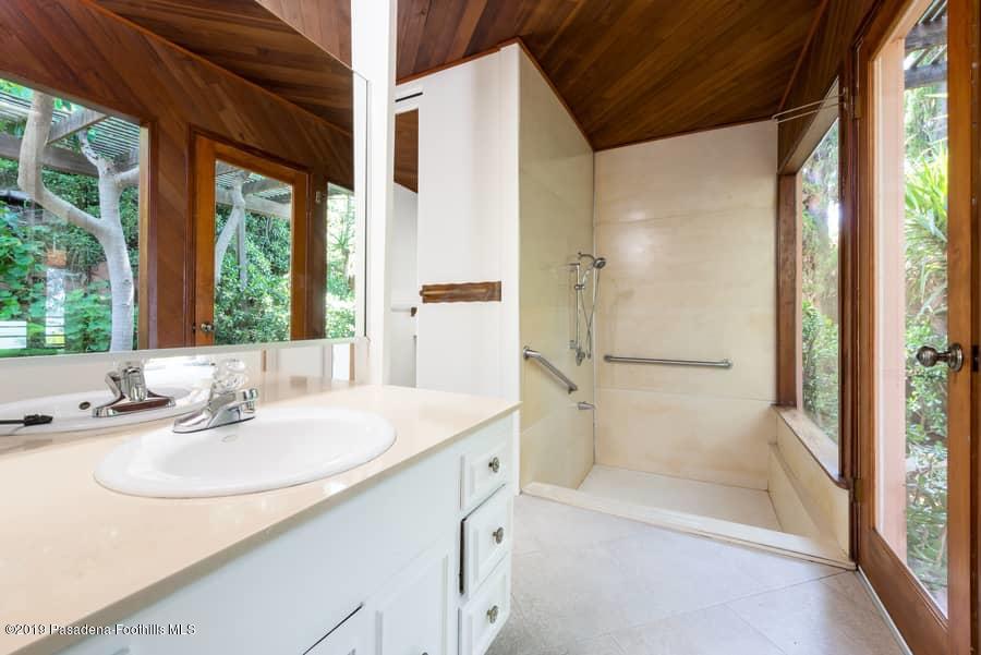 2107 Pinecrest Drive Altadena, CA 91001 - Photo 24 of 37 a bathroom with a sink and a mirror