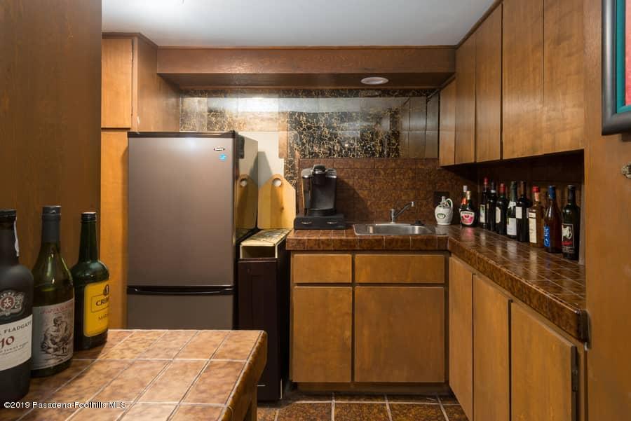 2107 Pinecrest Drive Altadena, CA 91001 - Photo 33 of 37 a kitchen with refrigerator and window