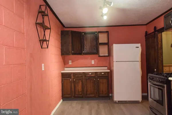 a view of a elevator with wooden floor