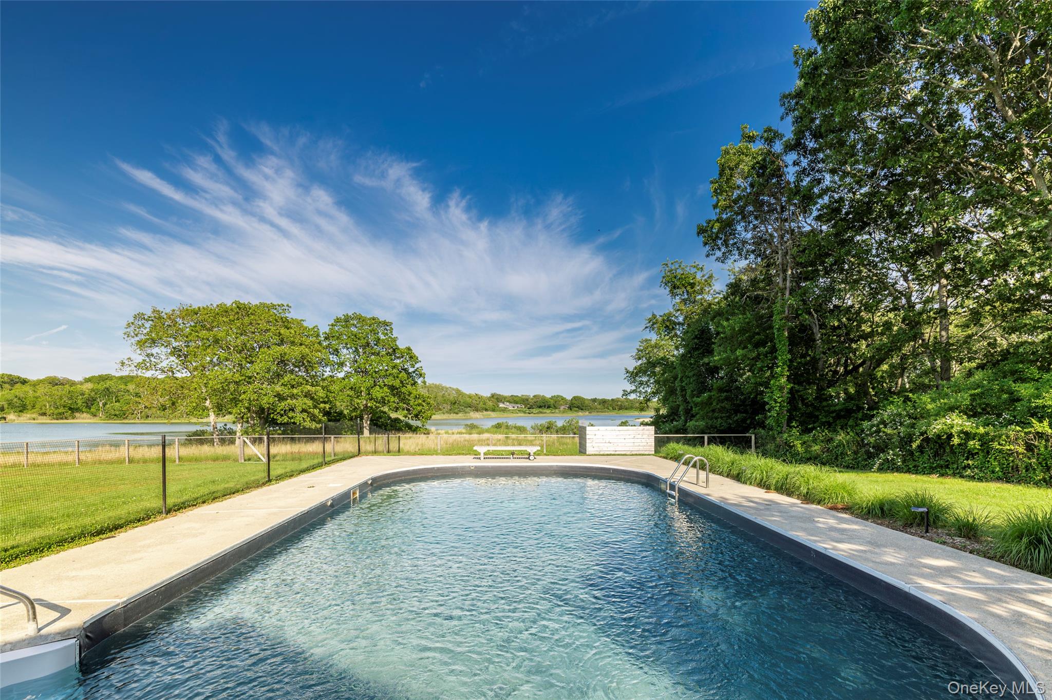 13 Tarkettle Road Shelter Island, NY 11964 - Photo 10 of 23 a view of a swimming pool and an outdoor space