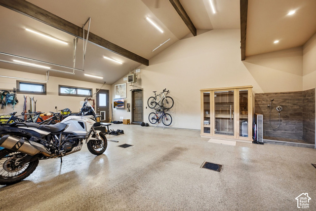 1130 Pace Road Park City, UT 84098 - Photo 54 of 73 Spacious garage with high vaulted ceilings, exposed wood beams, and a durable epoxy-coated concrete floor