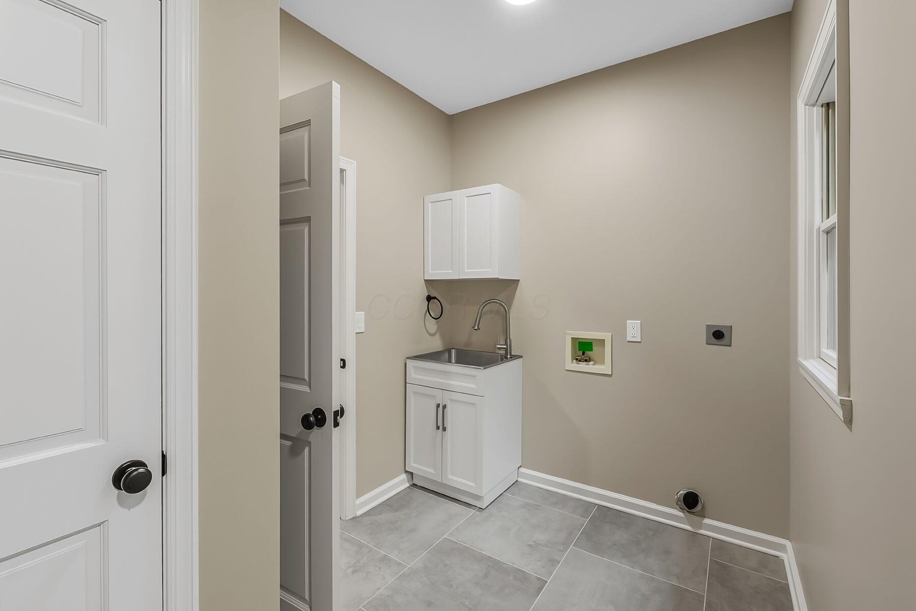 14617 Morse Road Southwest Pataskala, OH 43062 - Photo 35 of 69 FIRST FLOOR LAUNDRY ROOM