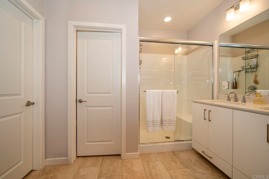 835 Blackstone Drive San Marcos, CA 92078 - Photo 14 of 30 a bathroom with a shower and a sink