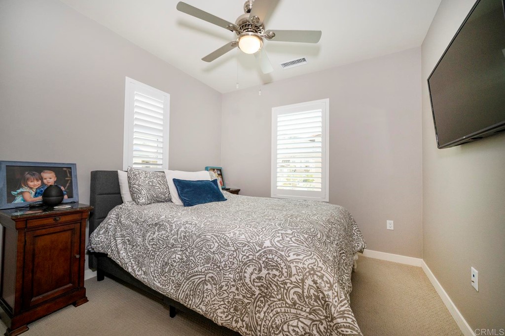 835 Blackstone Drive San Marcos, CA 92078 - Photo 15 of 30 a bedroom with a bed and a flat screen tv