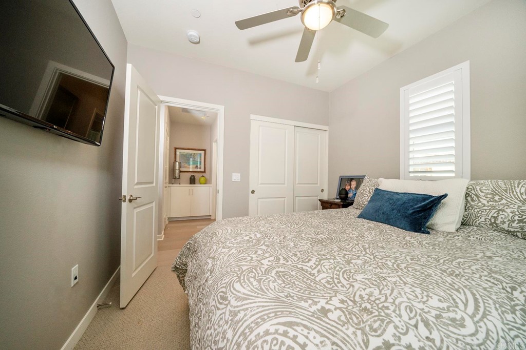 835 Blackstone Drive San Marcos, CA 92078 - Photo 16 of 30 a bedroom with a large bed and a flat screen tv