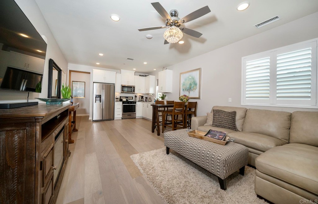 835 Blackstone Drive San Marcos, CA 92078 - Photo 4 of 30 a living room with furniture and a flat screen tv