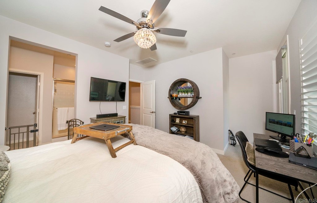 835 Blackstone Drive San Marcos, CA 92078 - Photo 10 of 30 a bedroom with a bed and a flat screen tv