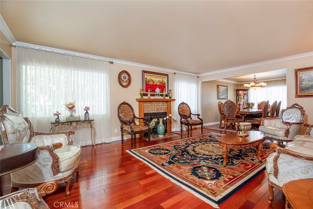 a spacious bedroom with a bed and a flat screen tv
