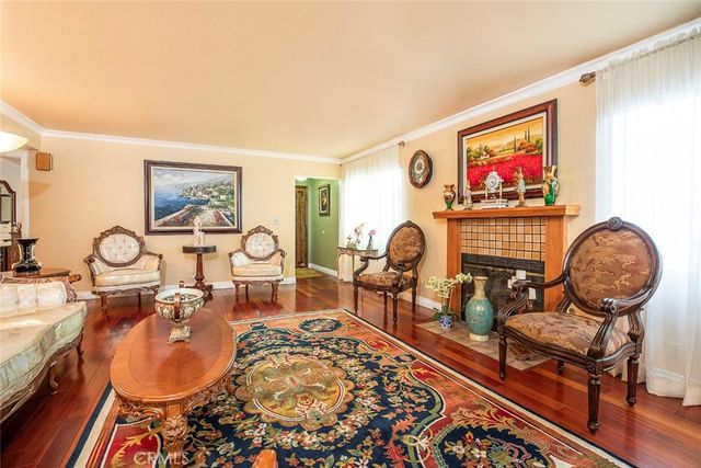 a bedroom with a bed and a dresser in it