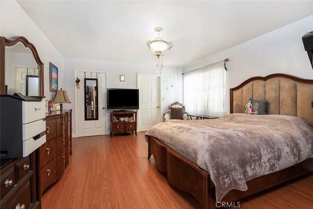 a living room with furniture a rug and a piano