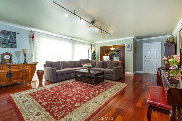 a bedroom with a bed window and couch