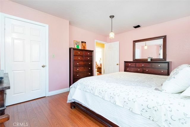 a bed room with a bed and a television