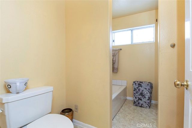 a kitchen with cabinets appliances a sink and a window