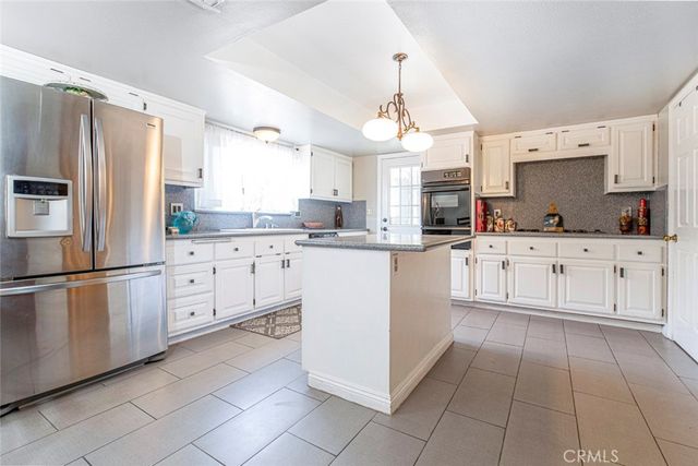 a view of house and a yard