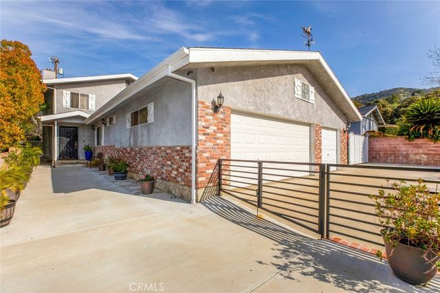 a view of hallway with wooden floor