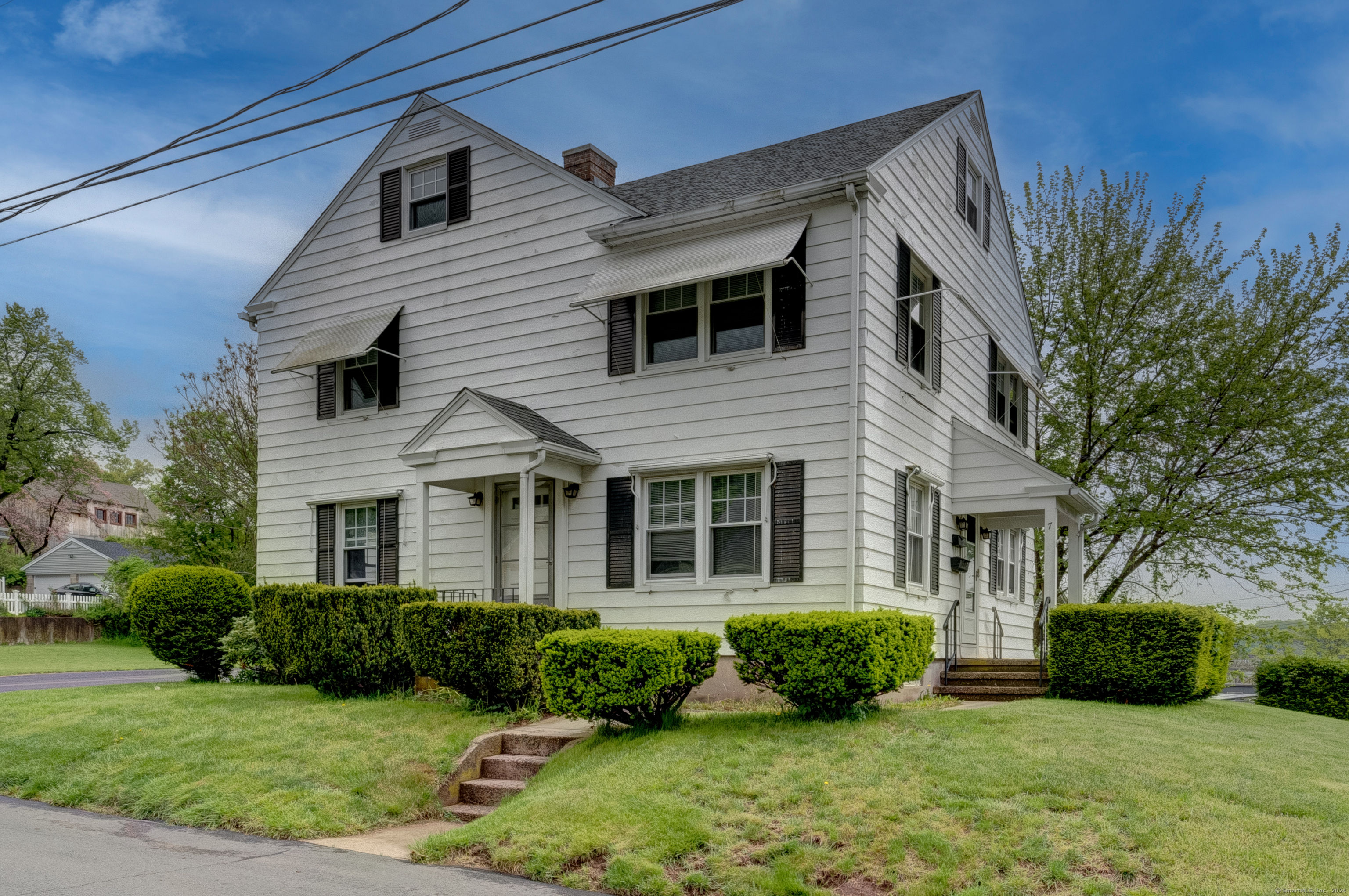 7 Rourke Avenue Southington, CT 06489 - Photo 1 of 1 a view of a house with a yard and plants