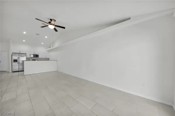a view of a kitchen with a sink and cabinet