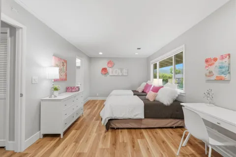 a bedroom with a bed and a dresser