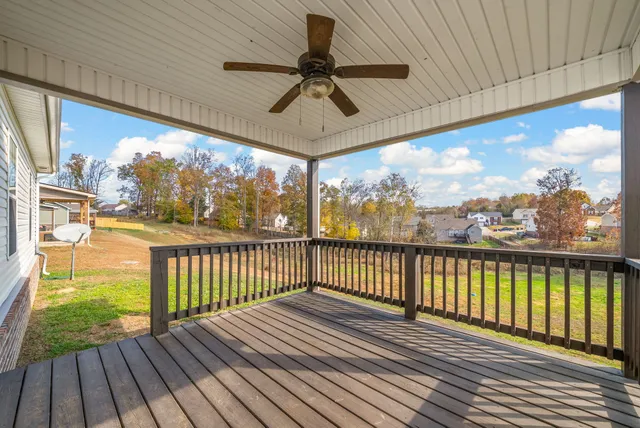 a view of a balcony with furniture