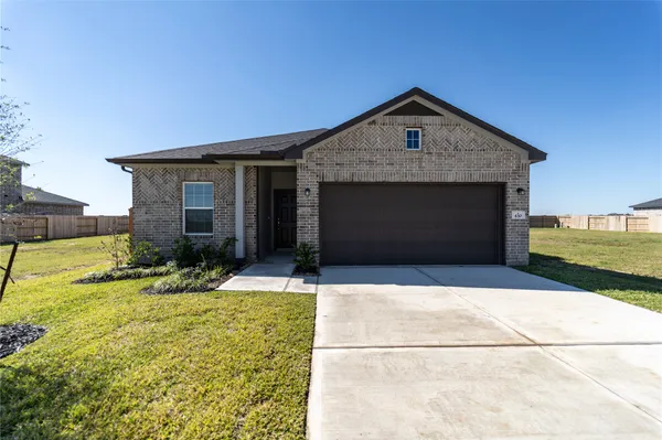 a front view of a house with yard