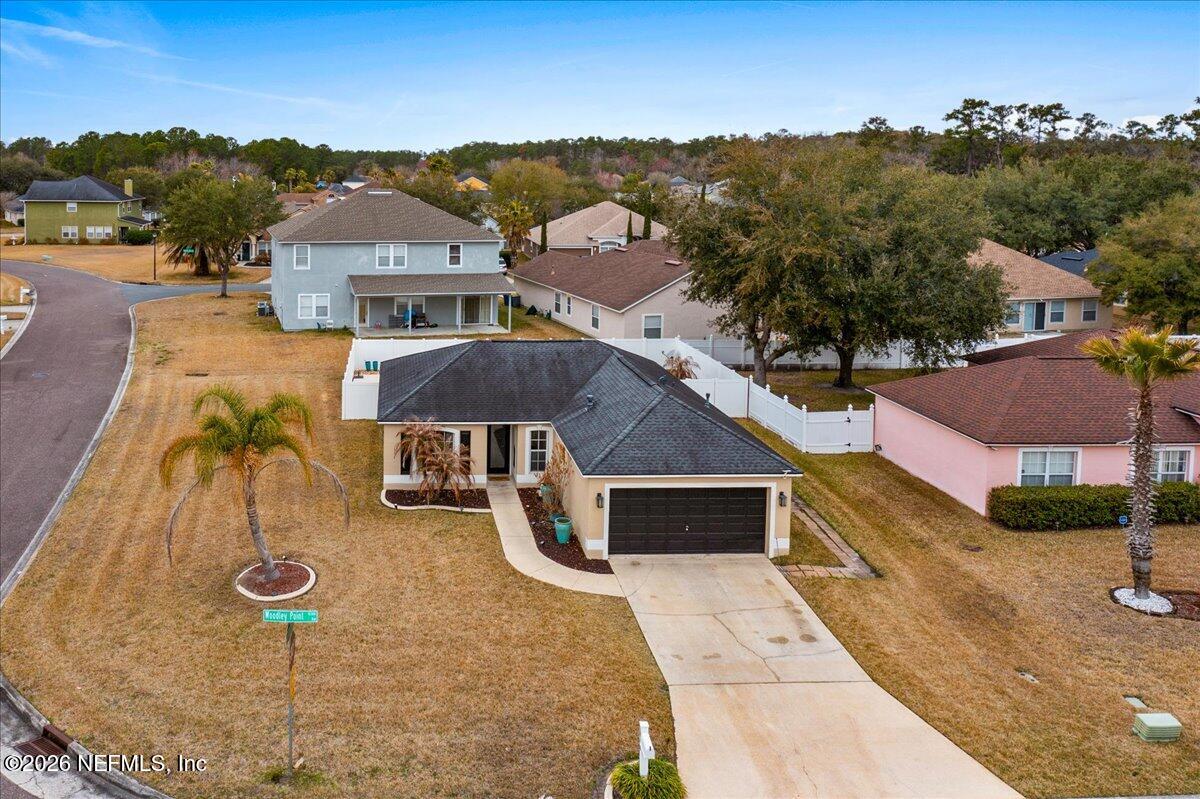 10310 Woodley Point Road Jacksonville, FL 32218 - Photo 30 of 30 an aerial view of a house with a garden and yard
