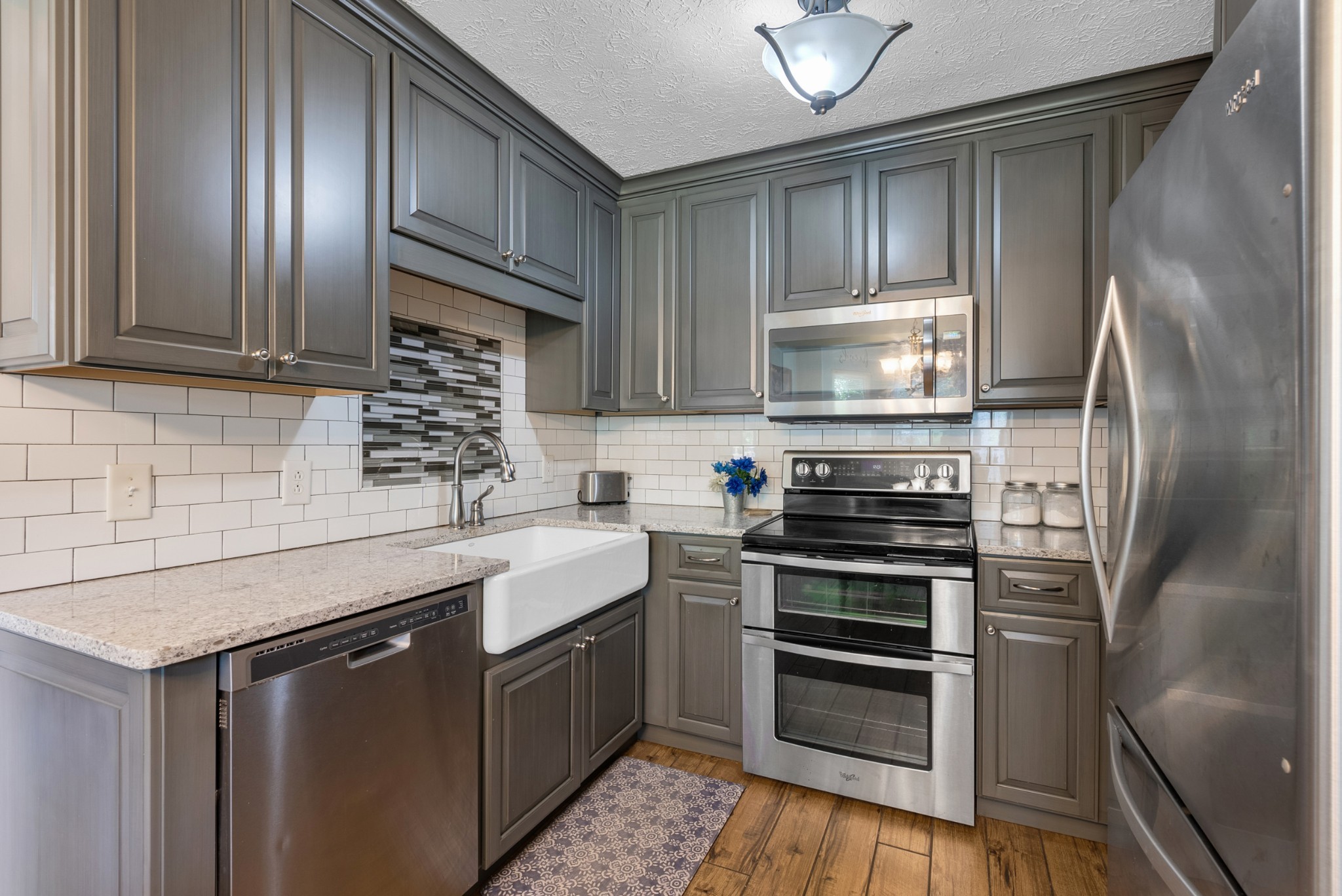 2220 Pleasant View Road Pleasant View, TN 37146 - Photo 11 of 34 a kitchen with stainless steel appliances granite countertop a sink stove and refrigerator