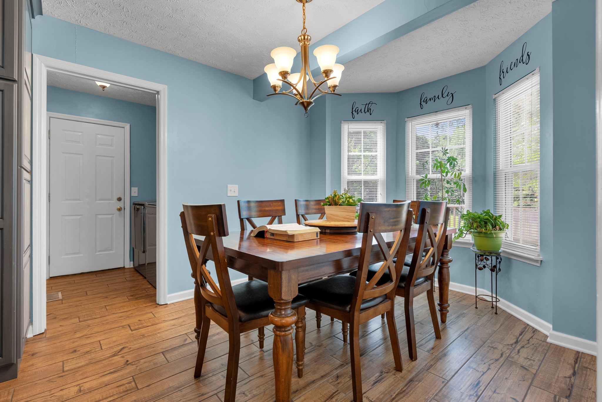 2220 Pleasant View Road Pleasant View, TN 37146 - Photo 14 of 34 a view of a dining room with furniture a chandelier and wooden floor