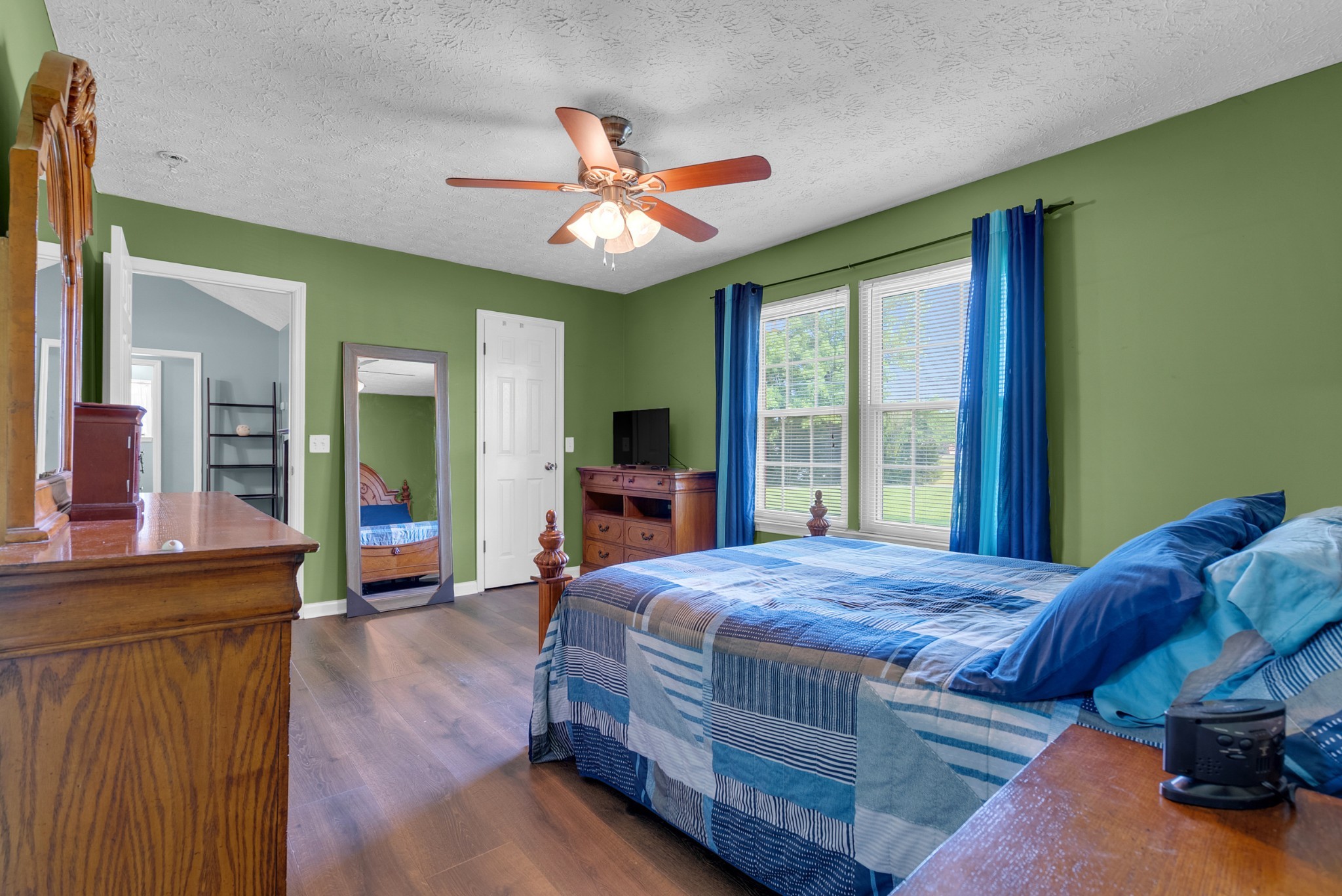 2220 Pleasant View Road Pleasant View, TN 37146 - Photo 17 of 34 a bedroom with a bed and a chandelier