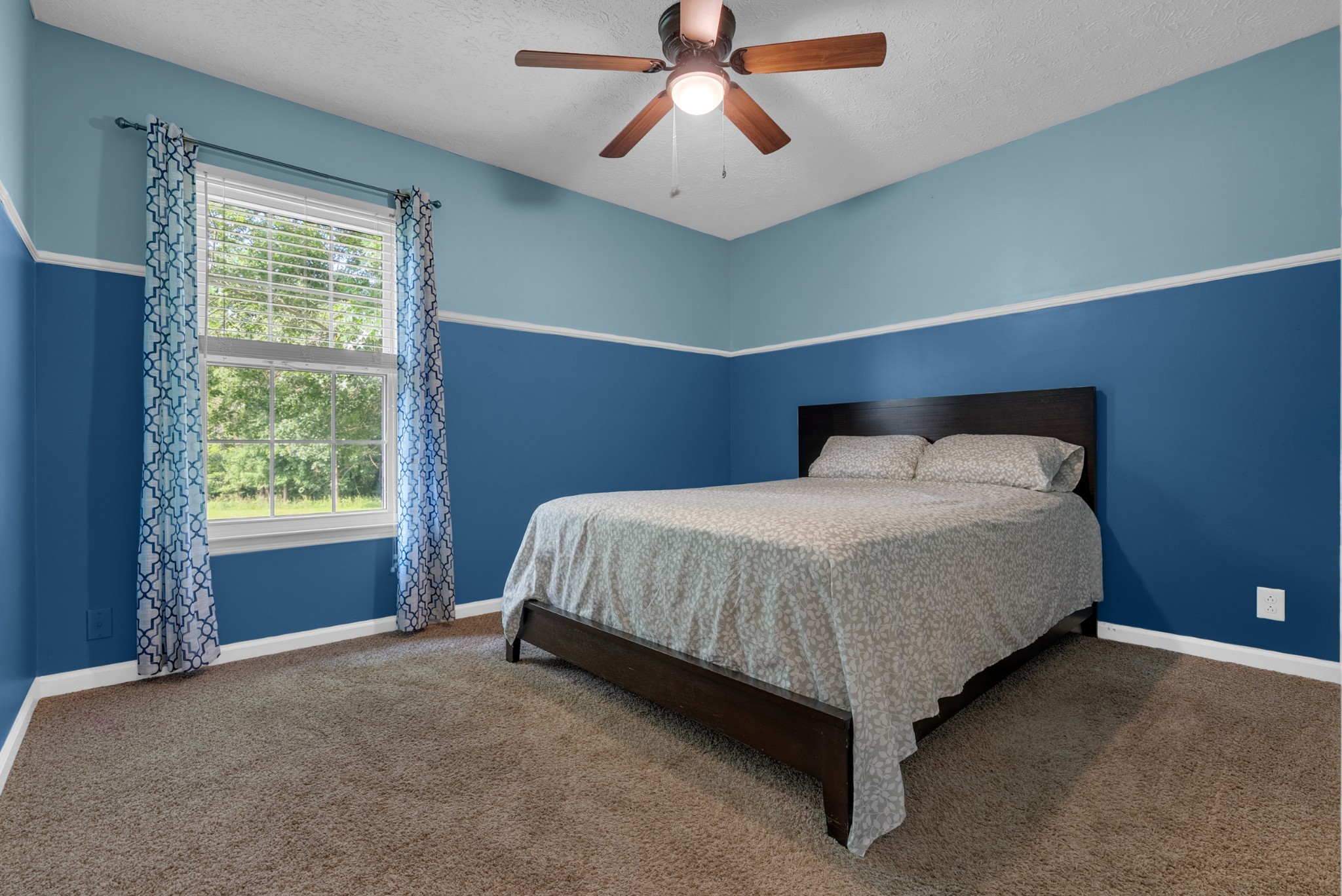 2220 Pleasant View Road Pleasant View, TN 37146 - Photo 21 of 34 a bed sitting in a room next to a window