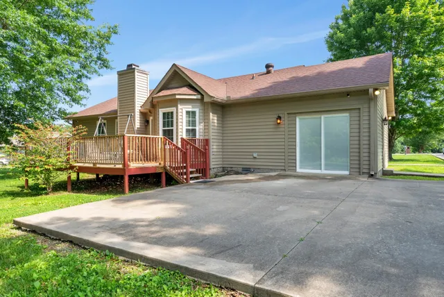 a view of a house with a yard and garage