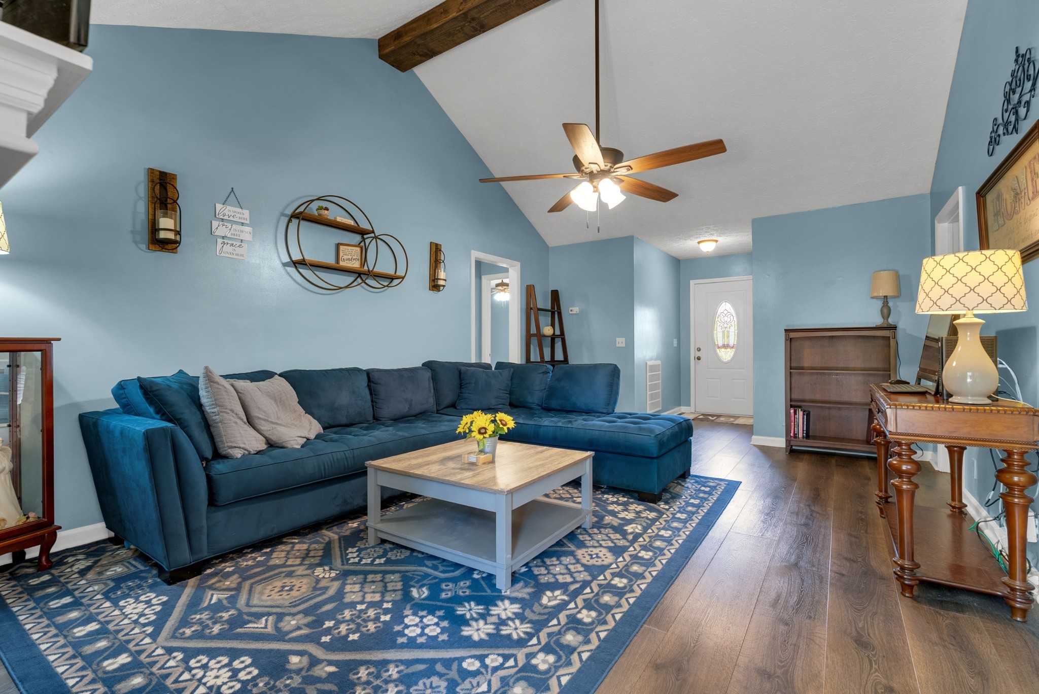 2220 Pleasant View Road Pleasant View, TN 37146 - Photo 7 of 34 a living room with furniture a rug and a chandelier