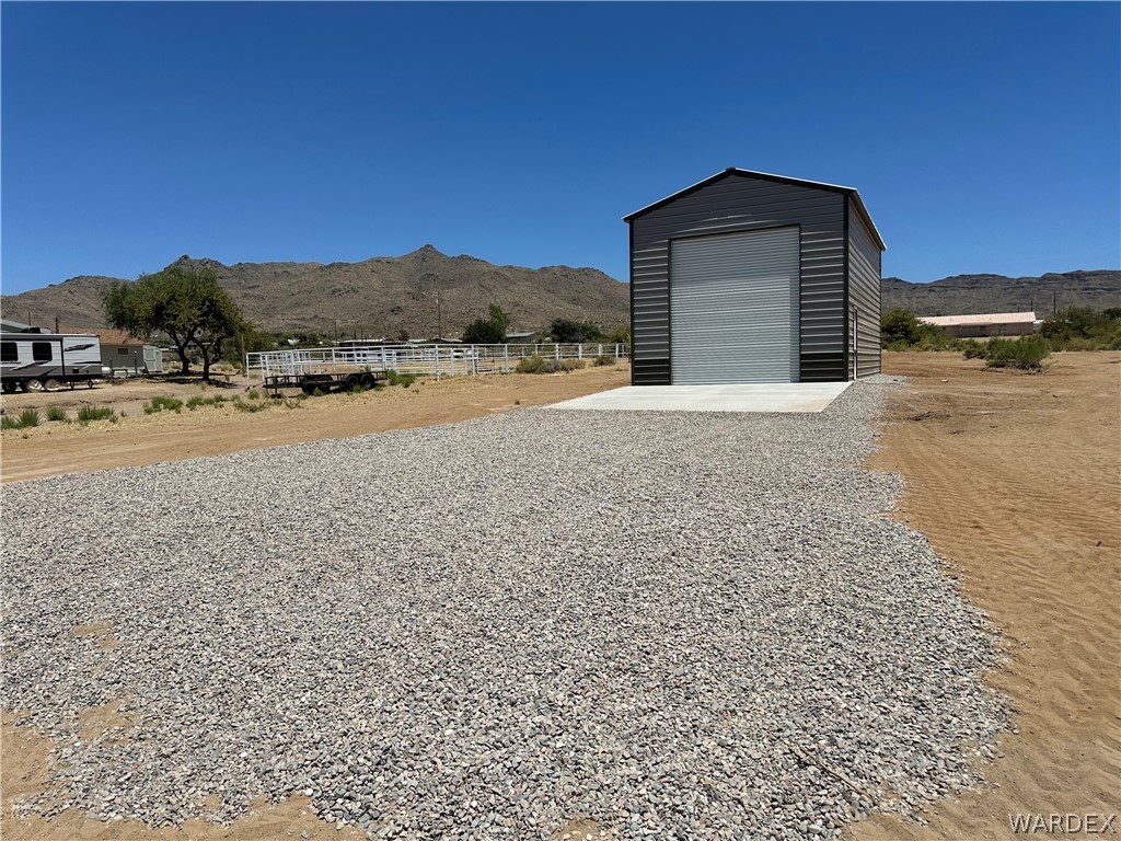 3180 North Bryce Road Golden Valley, AZ 86413 - Photo 3 of 10 a view of a house with a yard