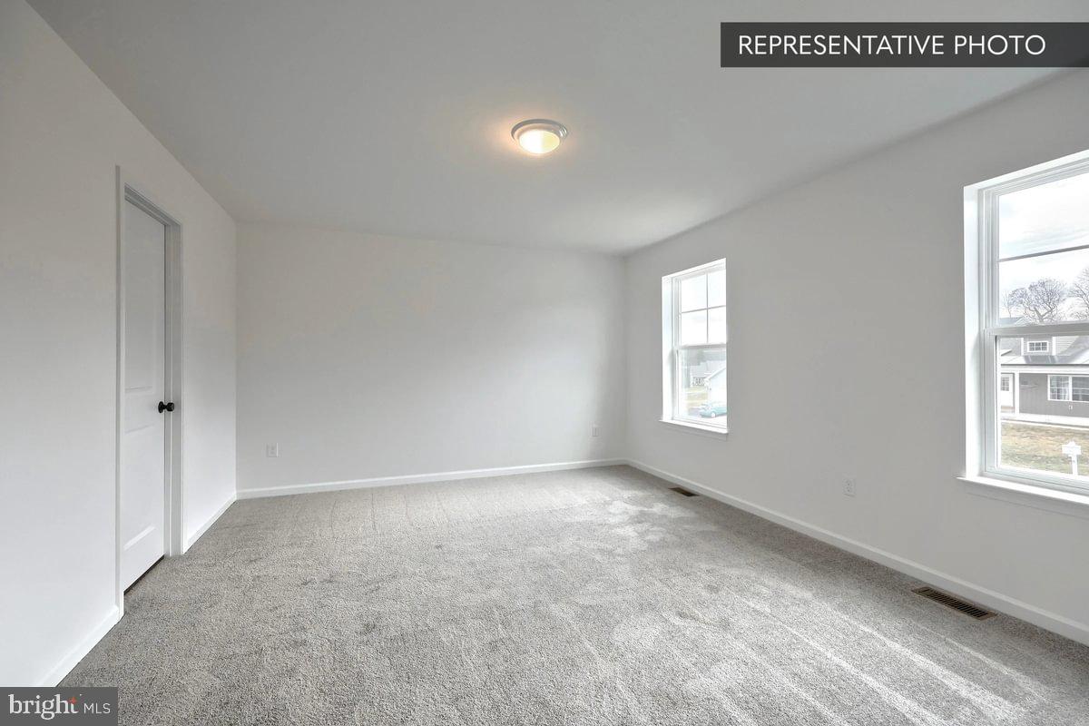 6328 Liam Drive Spring Grove, PA 17362 - Photo 15 of 18 an empty room with windows and closet