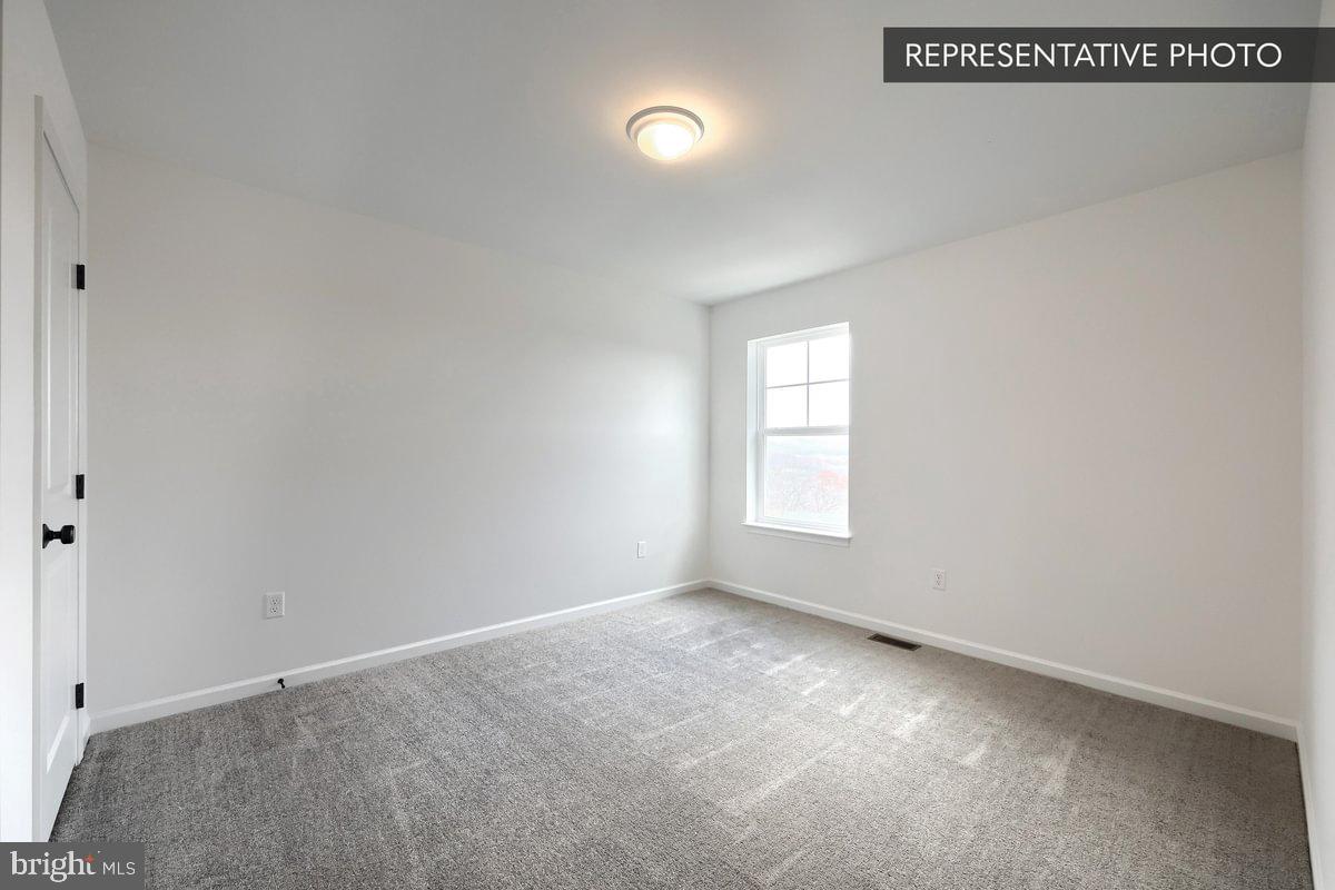 6328 Liam Drive Spring Grove, PA 17362 - Photo 18 of 18 a view of an empty room with a window