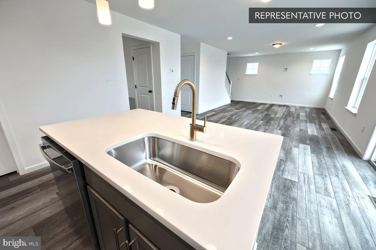 6328 Liam Drive Spring Grove, PA 17362 - Photo 10 of 18 a kitchen with a sink and a stove