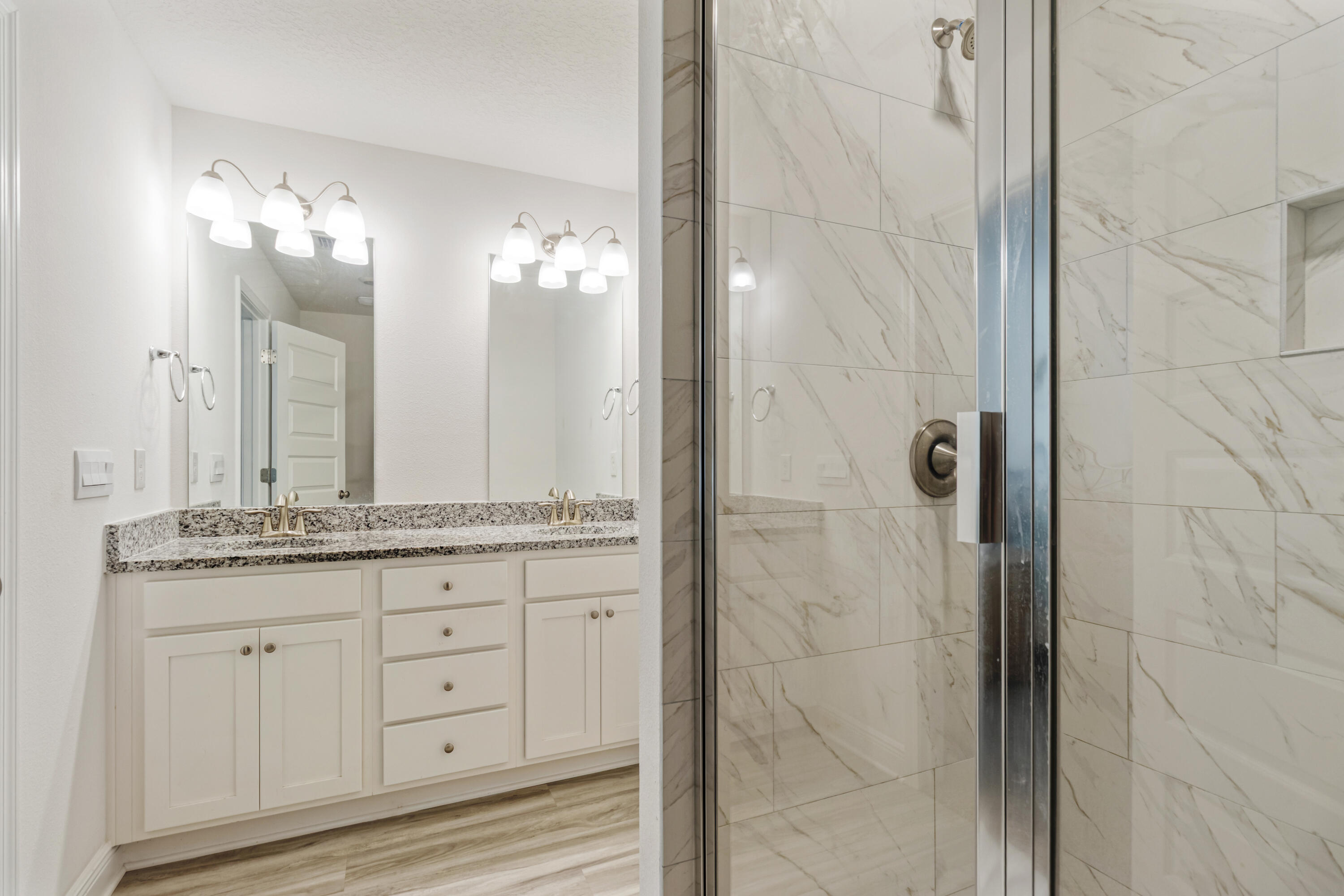 33 Sparrow Avenue Santa Rosa Beach, FL 32459 - Photo 16 of 27 Primary bathroom vanity and shower