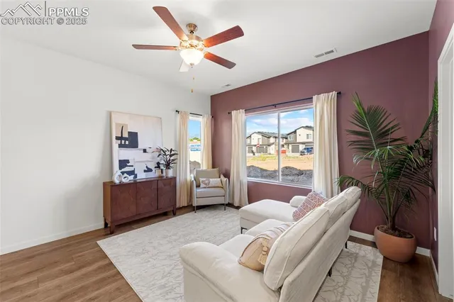 a living room with furniture and a large window