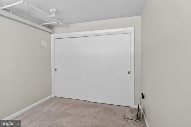 a view of a hallway with washer and dryer