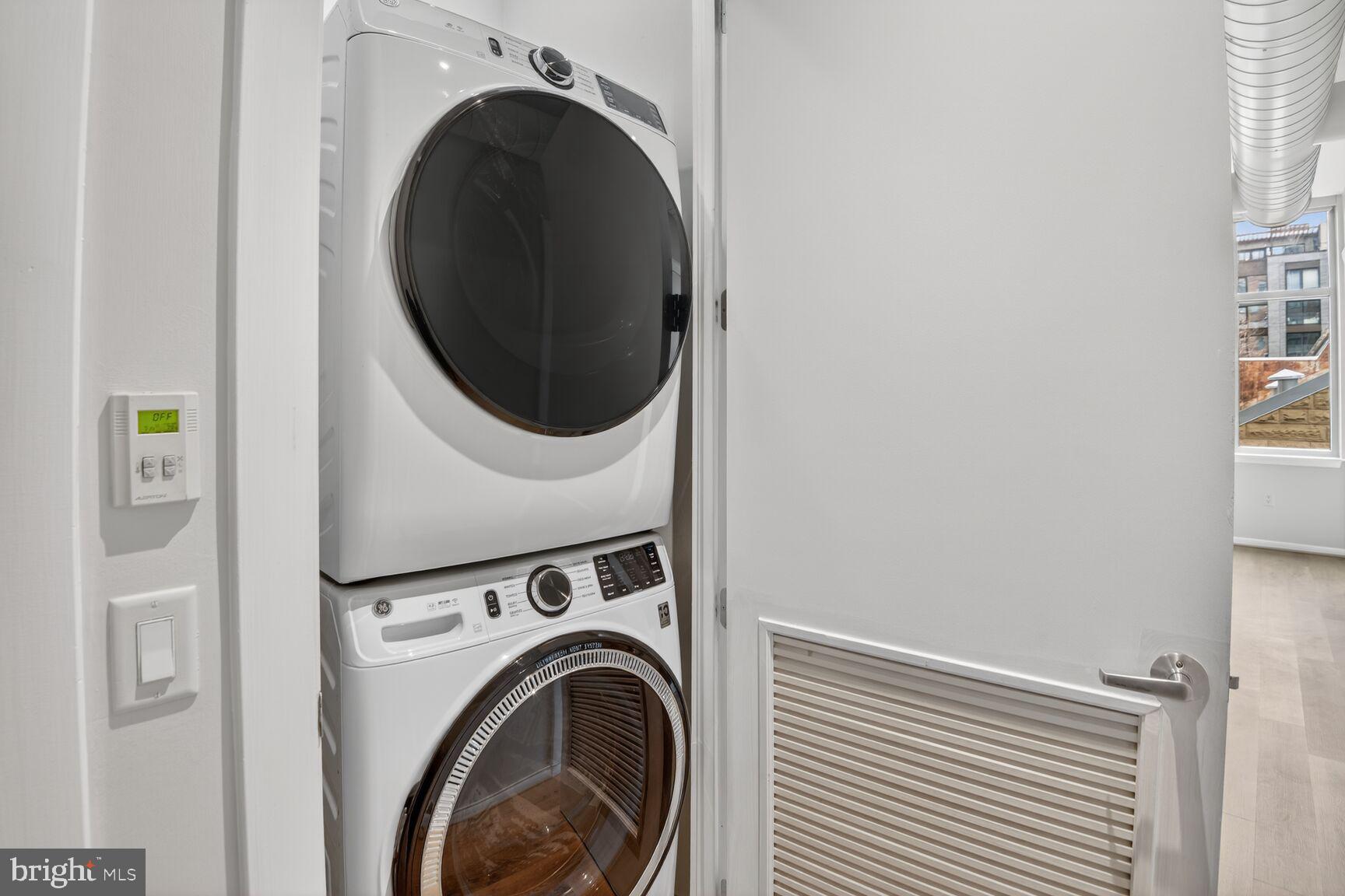 811 4th Street Northwest, Unit 503 Washington, DC 20001 - Photo 14 of 15 a view of a hallway with washer and dryer