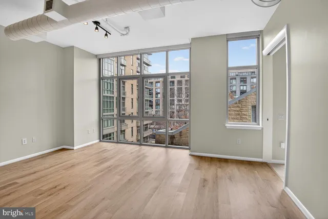 a view of an empty room with glass door