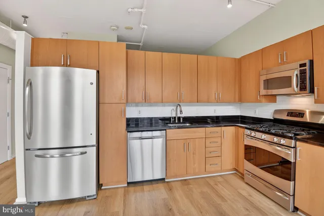 a white refrigerator freezer sitting inside of a kitchen
