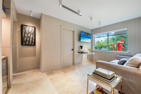 a living room with furniture and a window