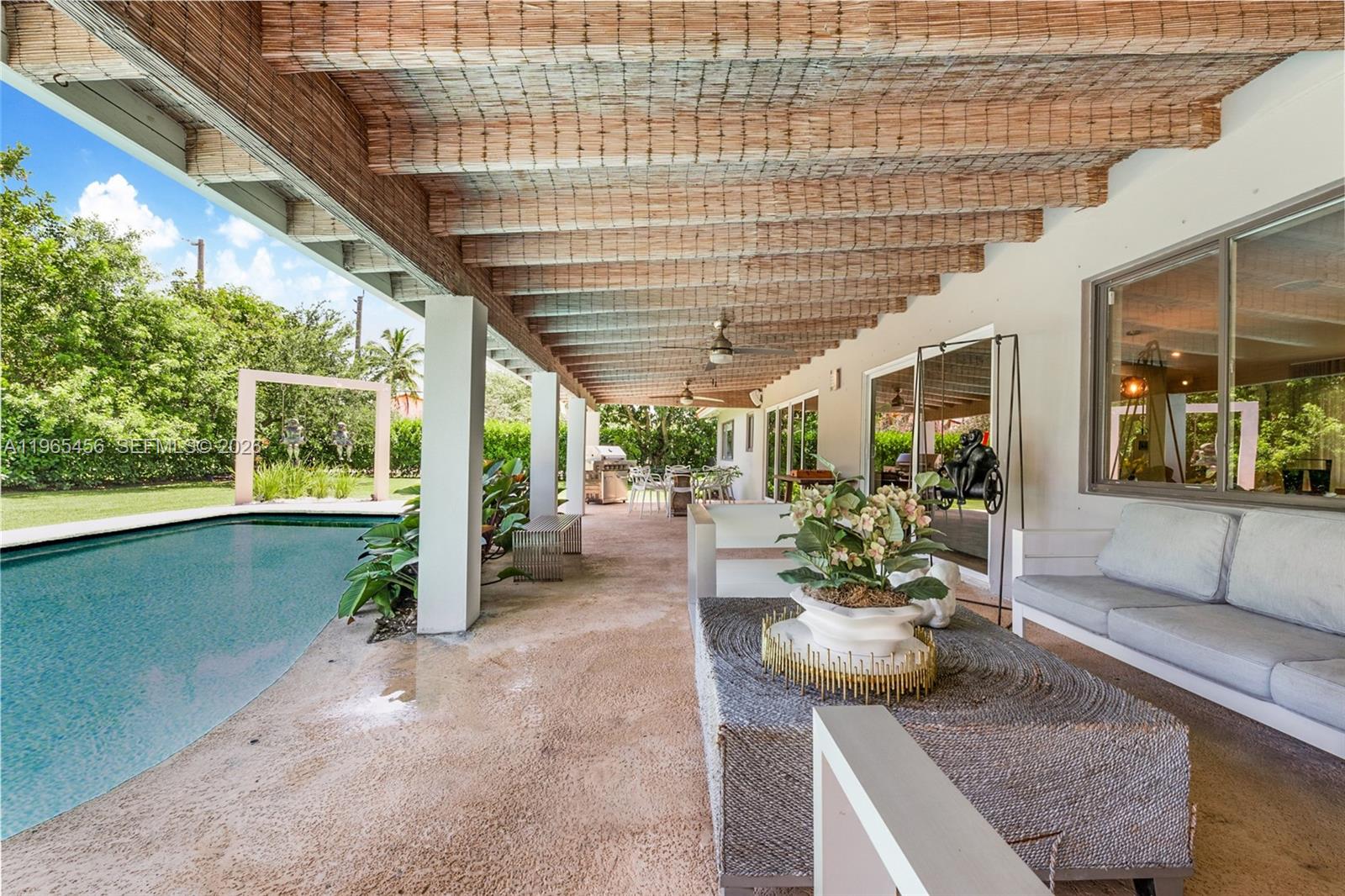 7401 Southwest 117th Street Pinecrest, FL 33156 - Photo 15 of 21 a view of a patio with plants and chairs