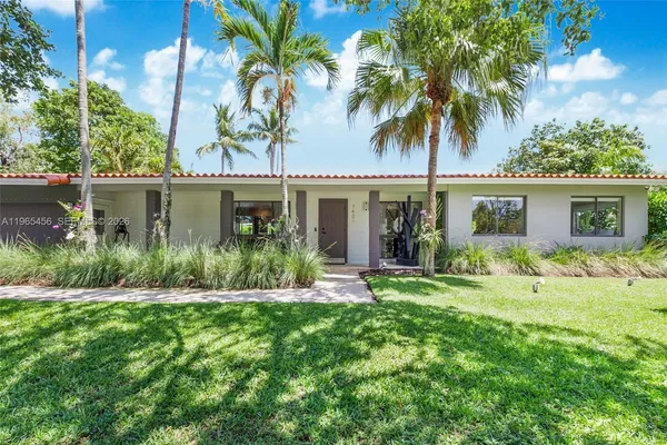 front view of a house with a yard